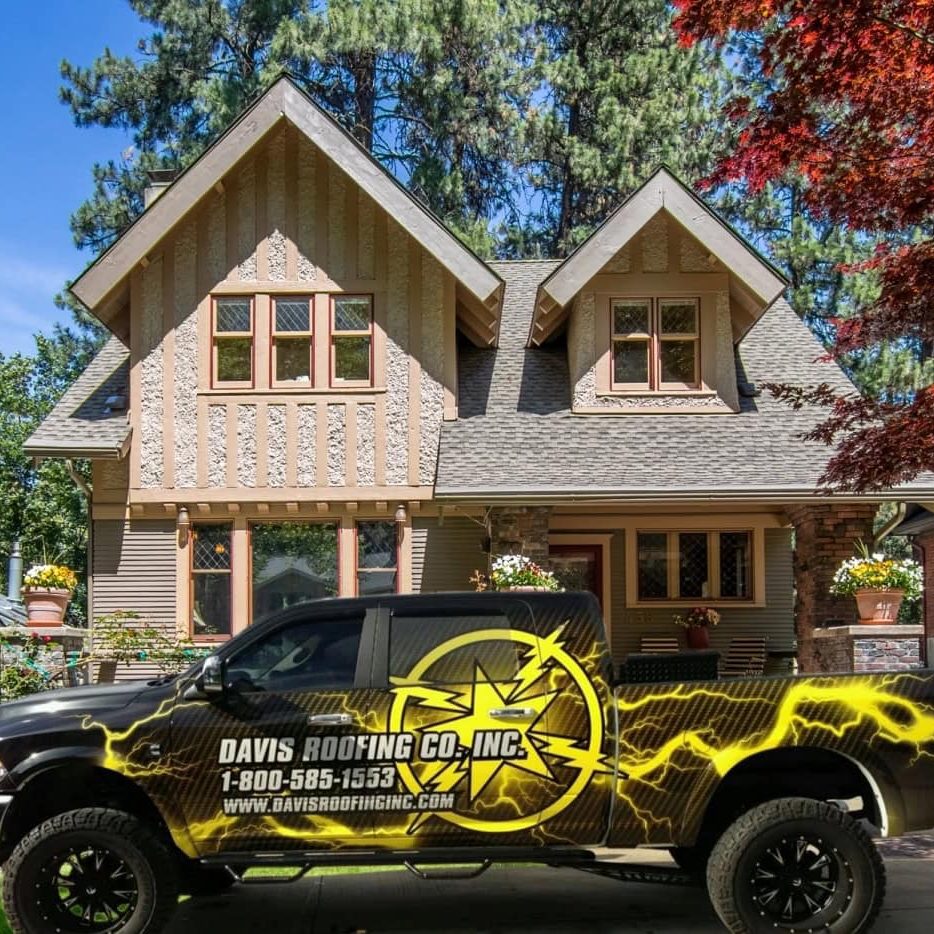 Roofing company truck with Davis Roofing Co Inc logo and contact info.