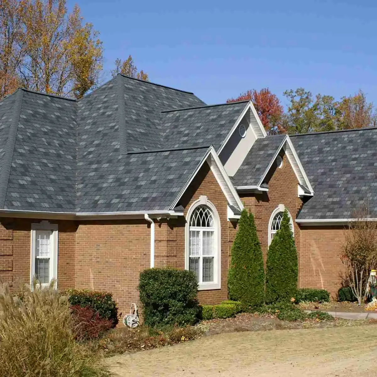 Expert roof replacement with durable shingles on a residential home.
