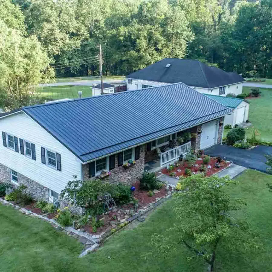 New metal roof installation on residential home by Davis Roofing Co Inc.
