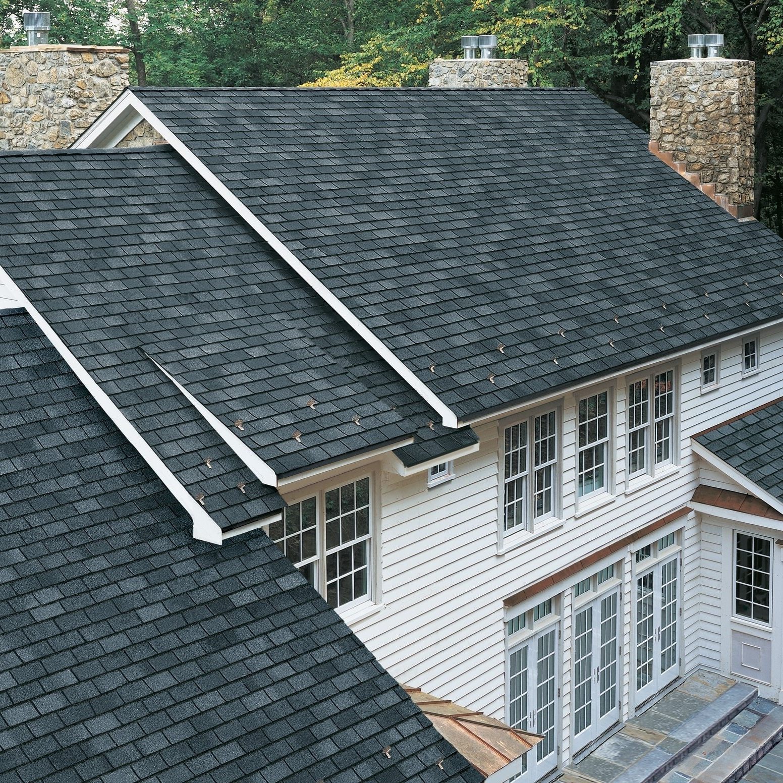 High-quality asphalt shingle roof on a modern residential home.