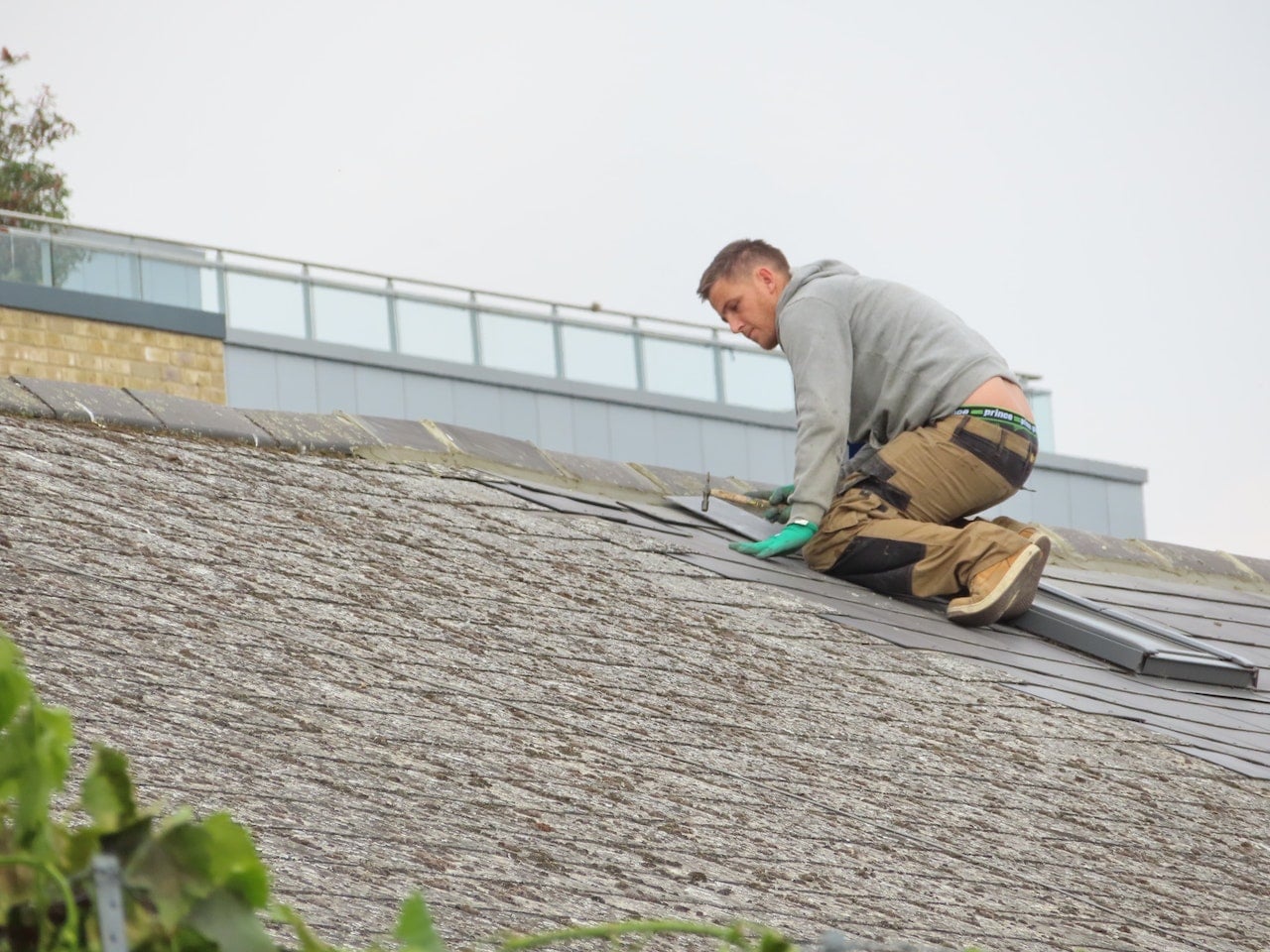 man working on roof.
